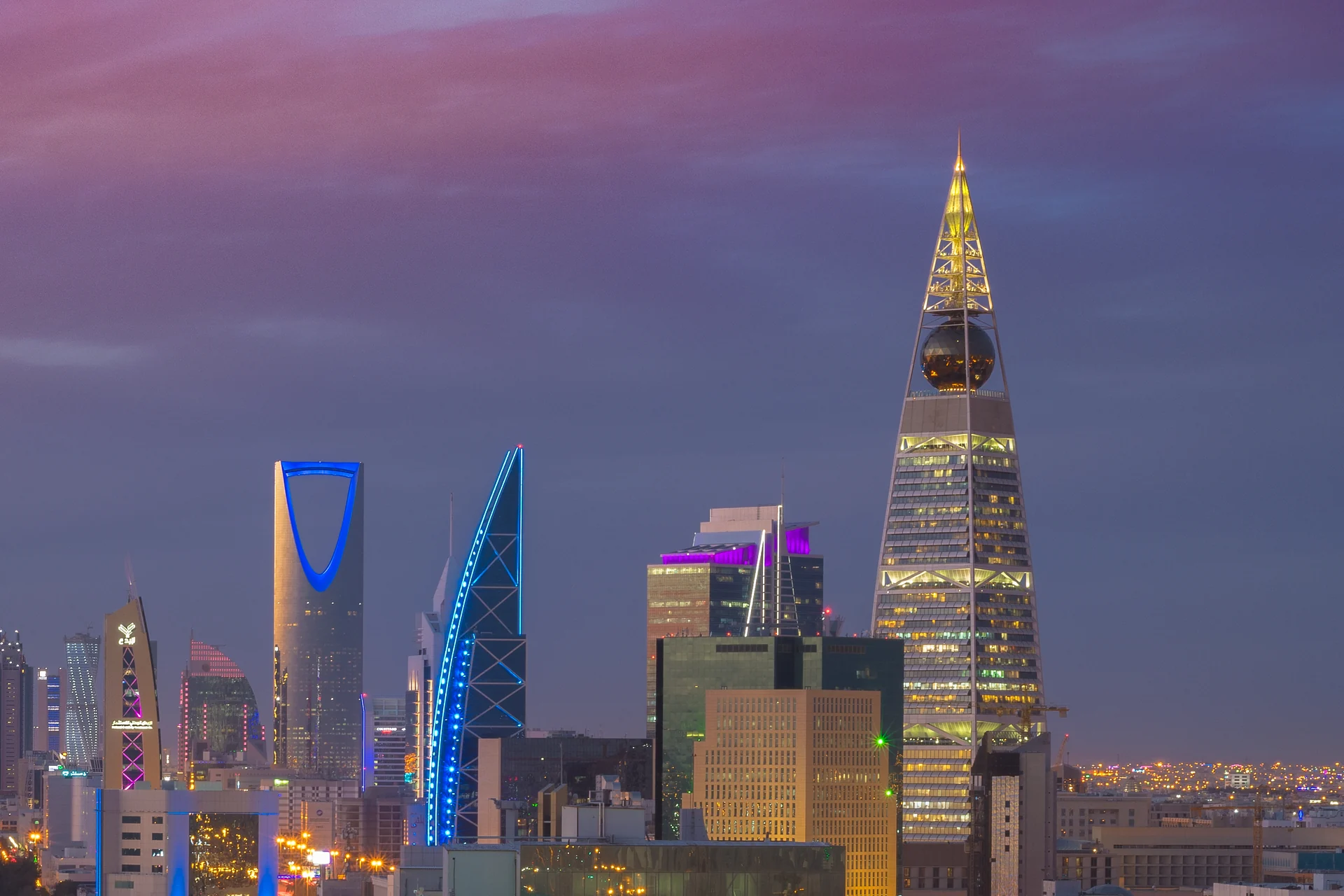 Riyadh skyline at dusk with the Kingdom Centre and Al Faisaliah Tower illuminated